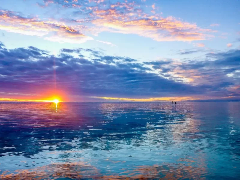 A sunset over a lagoon in the Cook Islands, Rarotonga