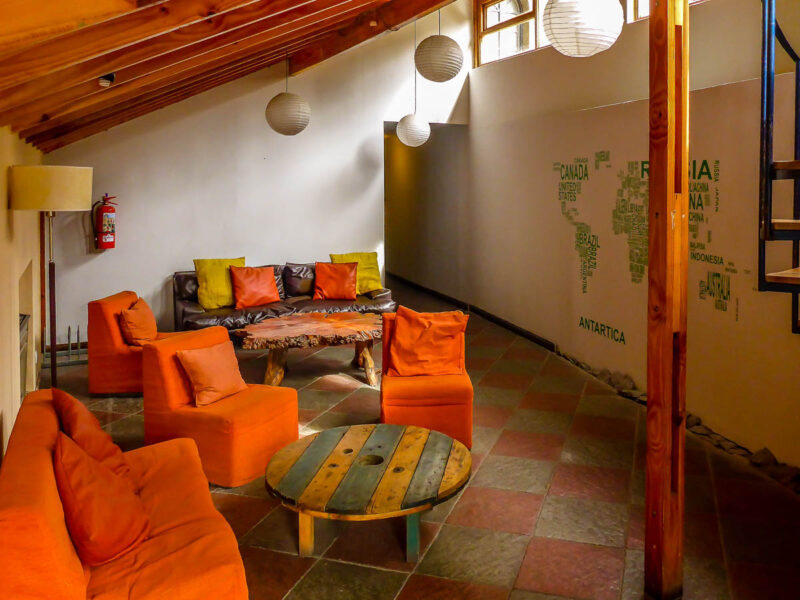 Bright orange colored seating area in a hostel