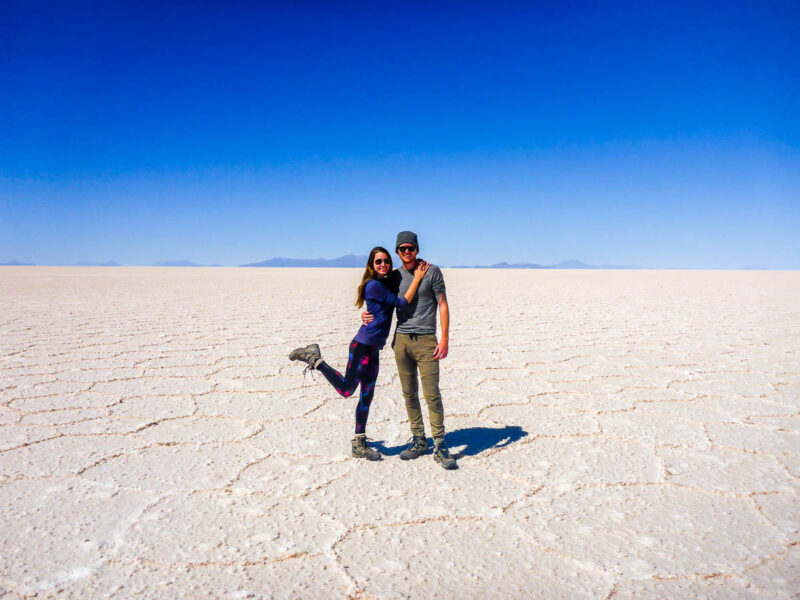 A couple standing on the Salt Flats in Bolivia