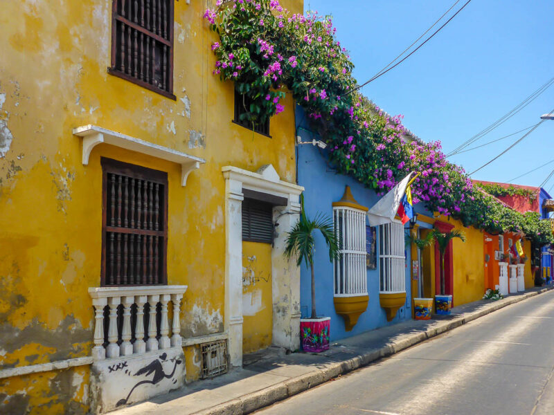 Multi-colored buildings adorned with flowers in the romantic destination of Cartagena, Colombia