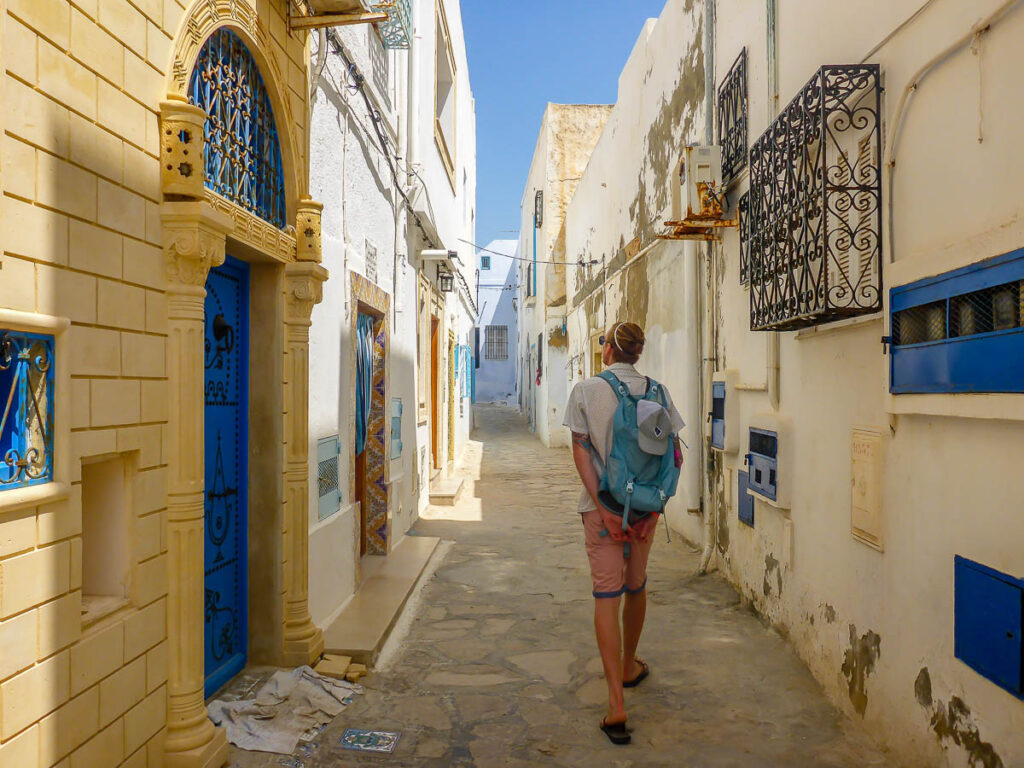 A man walking through the streets of Old Town, Hammamet, Tunisia