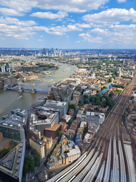 View of London, England from the viewing deck at the Shard. The River Thames, London Bridge and the city skyline.