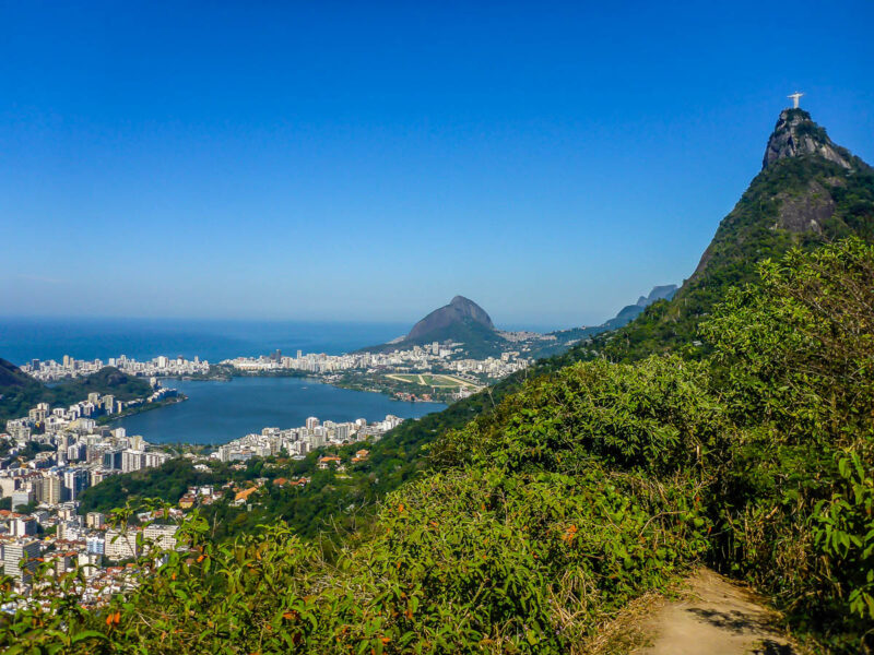 A view from a mountain of Rio de Janeiro, Sugarloaf Mountain, Christ the Redeemer, the city, lagoon and ocean with clear bright blue skies