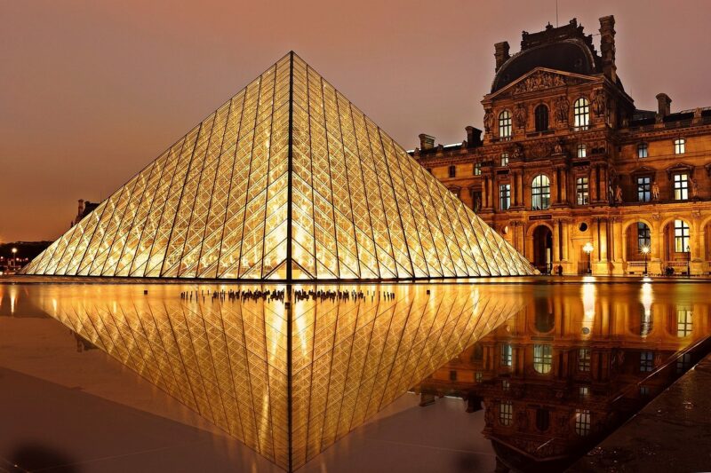 Louvre, famous art gallery in Paris at night