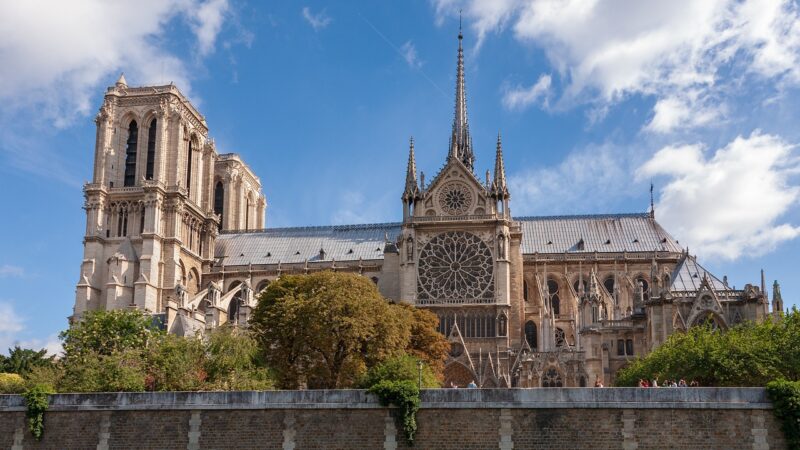 Cathédrale Notre-Dame de Paris from the side with blue skies