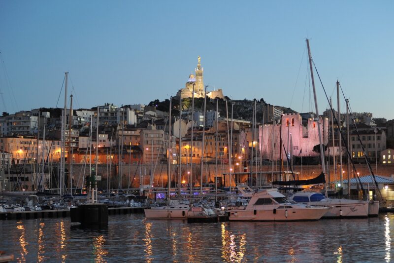 City of Marseille and the Old Port at night with waterfront lights, street lights, and city nightlife